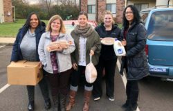 Staff deliver full Thanksgiving meals to families in need in Indianapolis.